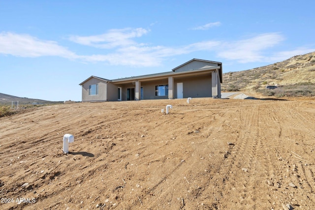 view of front of property with a mountain view