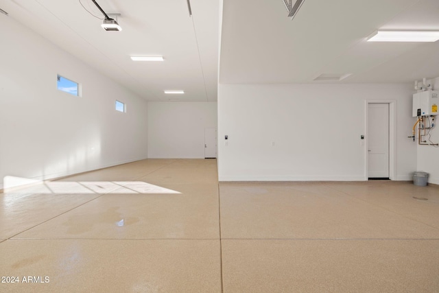 garage featuring tankless water heater