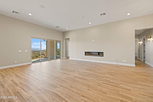 unfurnished living room with light hardwood / wood-style floors