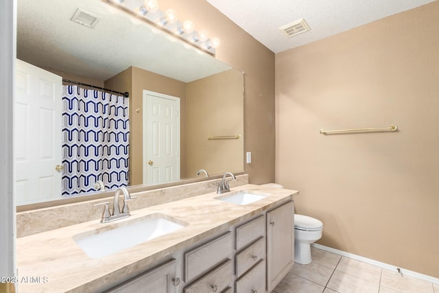 full bath featuring tile patterned flooring, a sink, and visible vents