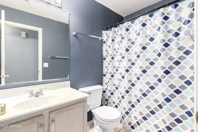 bathroom with a textured wall, toilet, a shower with curtain, a textured ceiling, and vanity