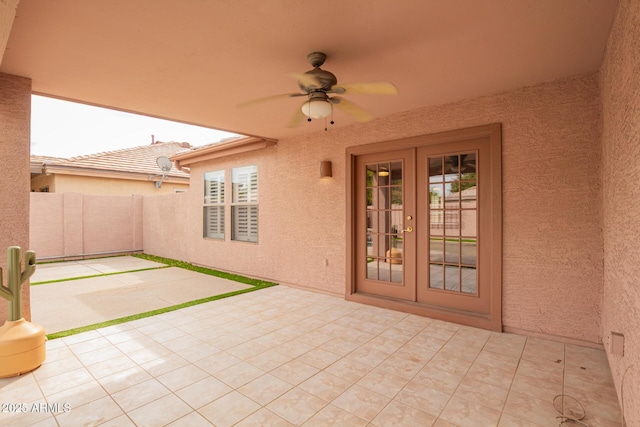 view of patio with french doors and a ceiling fan