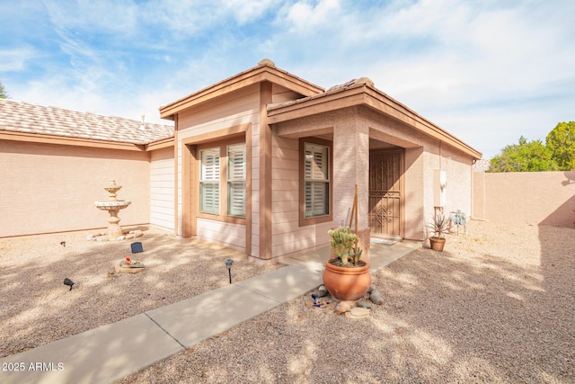 view of front of home with fence