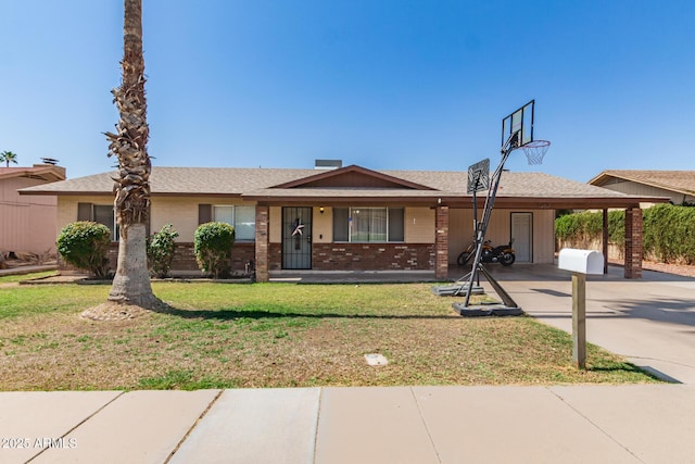 1263 W Del Rio St, Chandler, AZ 85224 - ranch-style home featuring a front lawn, driveway, brick siding, a carport, and a porch