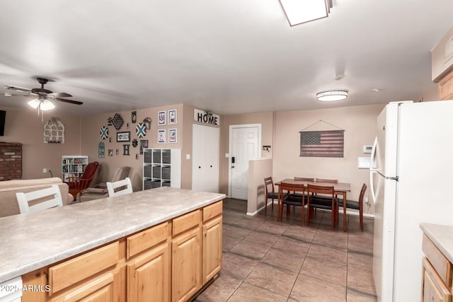 1263 W Del Rio St, Chandler, AZ 85224 - kitchen with freestanding refrigerator, a ceiling fan, light countertops, light tile patterned flooring, and open floor plan