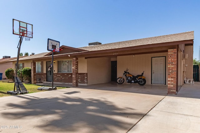 1263 W Del Rio St, Chandler, AZ 85224 - ranch-style house with brick siding, concrete driveway, a carport, and a shingled roof
