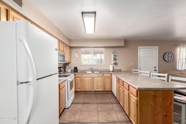 1263 W Del Rio St, Chandler, AZ 85224 - kitchen with white appliances, a peninsula, light brown cabinetry, a breakfast bar, and wine cooler