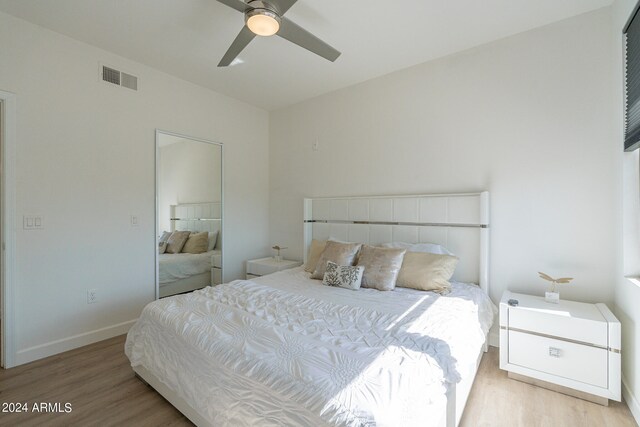 bedroom featuring light hardwood / wood-style flooring and ceiling fan