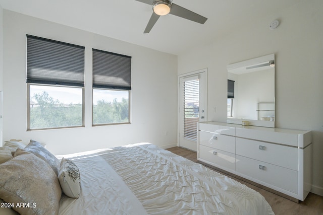 bedroom with light hardwood / wood-style flooring and ceiling fan