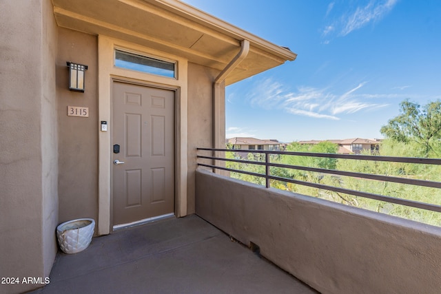 entrance to property featuring a balcony