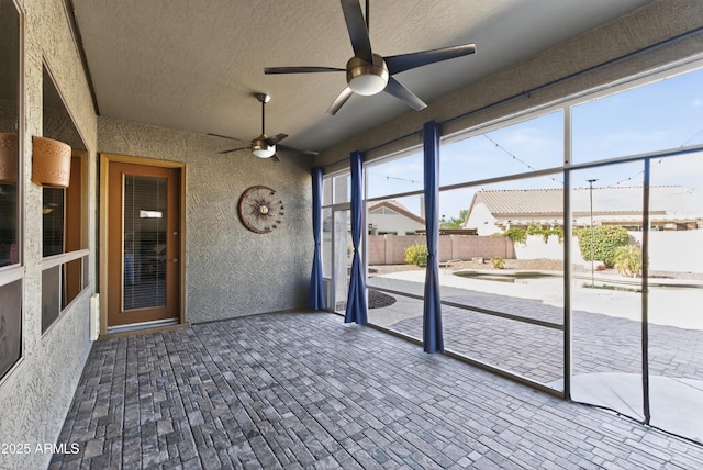 10897 S Turtle Dove Dr S, Goodyear, AZ 85338 - unfurnished sunroom featuring ceiling fan