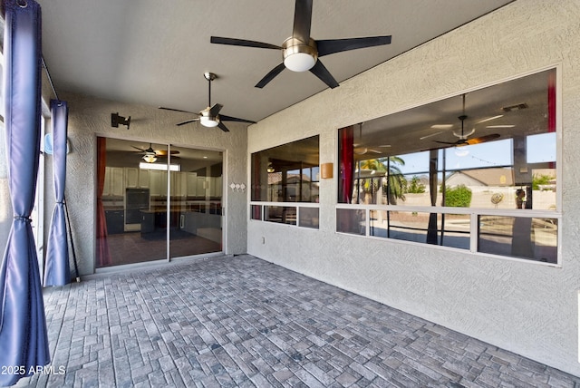 10897 S Turtle Dove Dr S, Goodyear, AZ 85338 - unfurnished sunroom with a ceiling fan