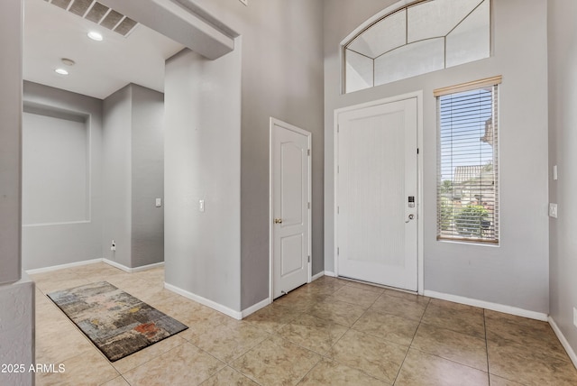 10897 S Turtle Dove Dr S, Goodyear, AZ 85338 - entrance foyer featuring tile patterned flooring, a high ceiling, and recessed lighting