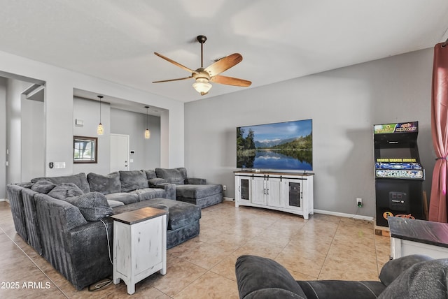 10897 S Turtle Dove Dr S, Goodyear, AZ 85338 - tiled living room featuring a ceiling fan and baseboards