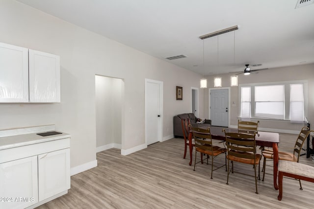 dining room featuring ceiling fan and light wood-type flooring