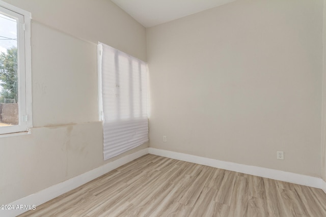 spare room with light wood-type flooring