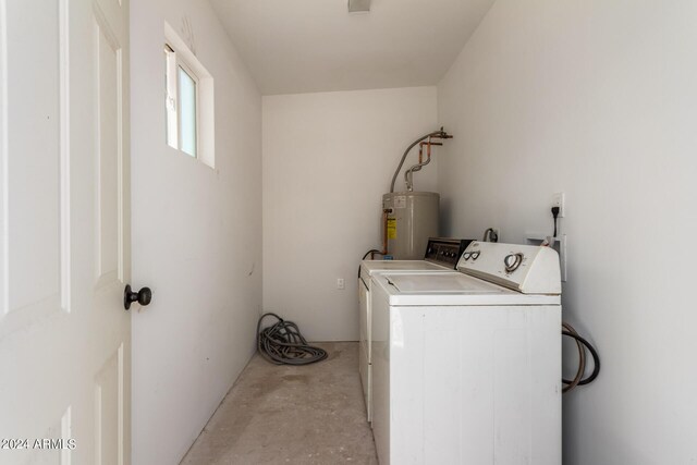 laundry room featuring separate washer and dryer and gas water heater