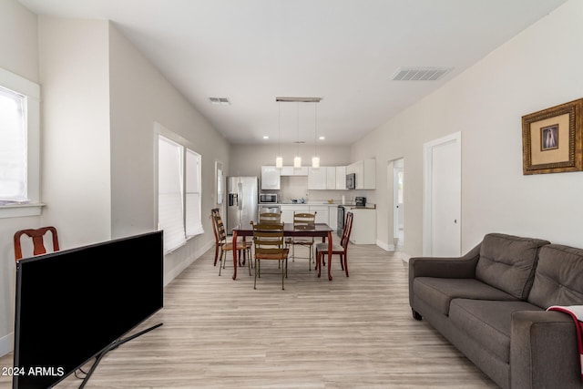 living room with light hardwood / wood-style floors