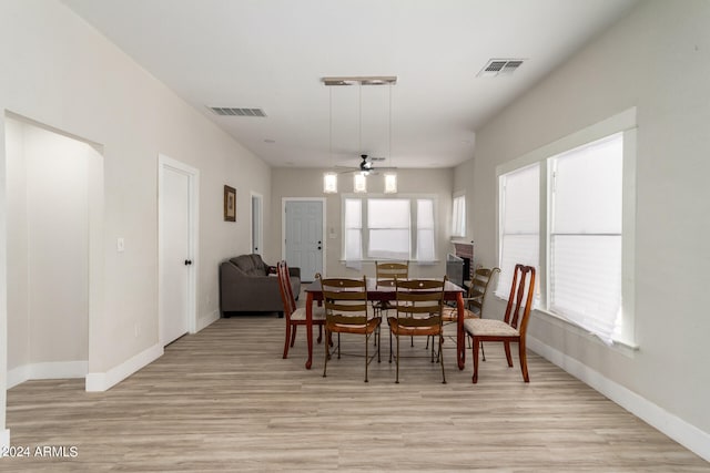 dining area featuring ceiling fan and light hardwood / wood-style floors