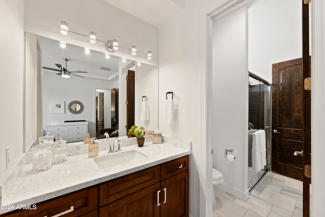 bathroom with ceiling fan, walk in shower, vanity, and toilet