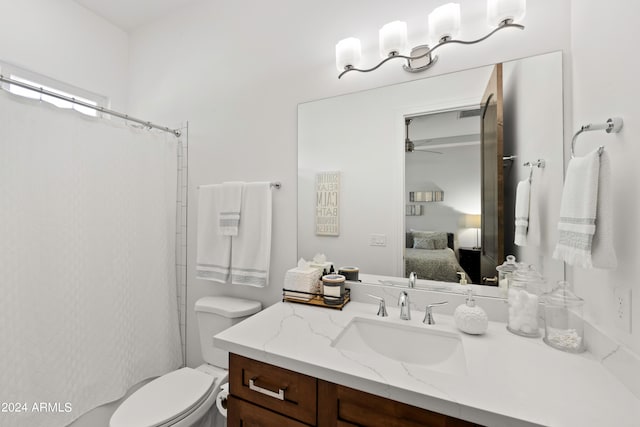 bathroom featuring walk in shower, vanity, toilet, and ceiling fan