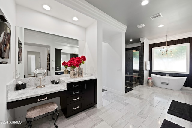 bathroom featuring an inviting chandelier, vanity, a tub to relax in, and crown molding