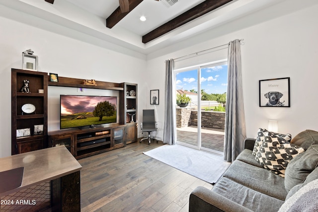 living room with beamed ceiling and dark wood-type flooring