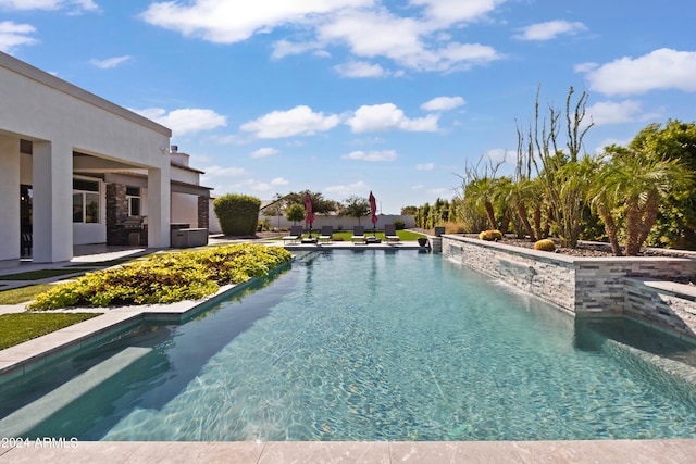 view of swimming pool with a patio area