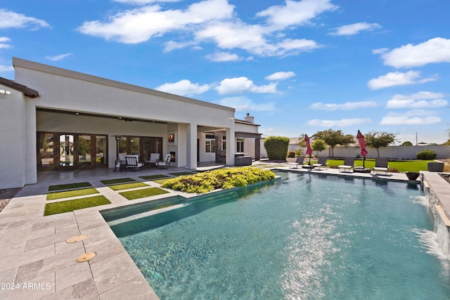 view of swimming pool featuring a patio and pool water feature