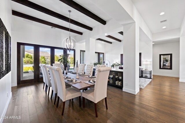 dining area featuring a high ceiling, beamed ceiling, dark wood-type flooring, and a chandelier