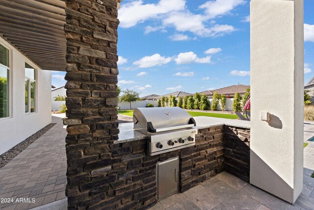 view of patio featuring area for grilling and grilling area