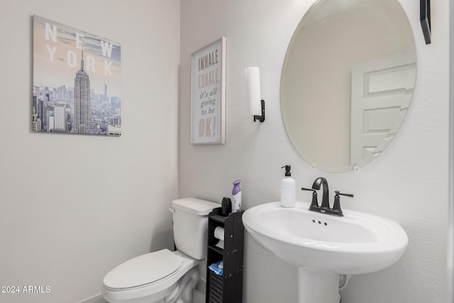 bathroom featuring sink and toilet