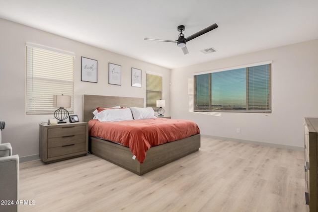 bedroom featuring ceiling fan and light hardwood / wood-style flooring