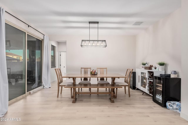 dining area with light hardwood / wood-style floors