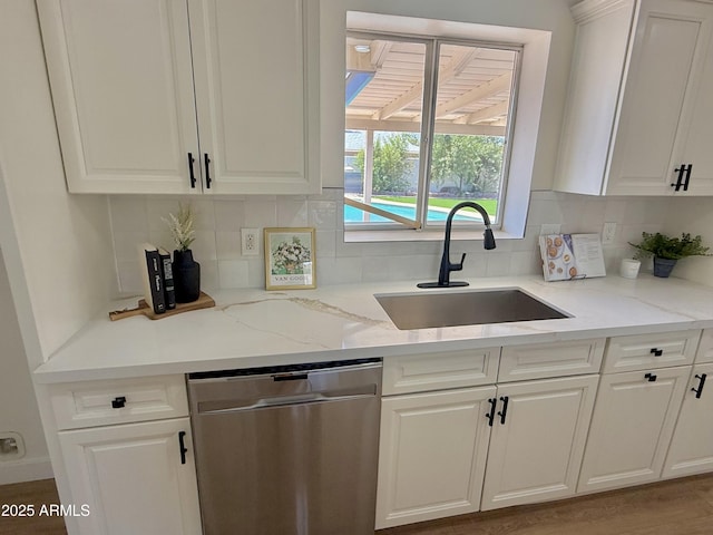 1421 W Pasadena Ave, Phoenix, AZ 85013 - kitchen featuring stainless steel dishwasher, white cabinetry, backsplash, and light stone countertops