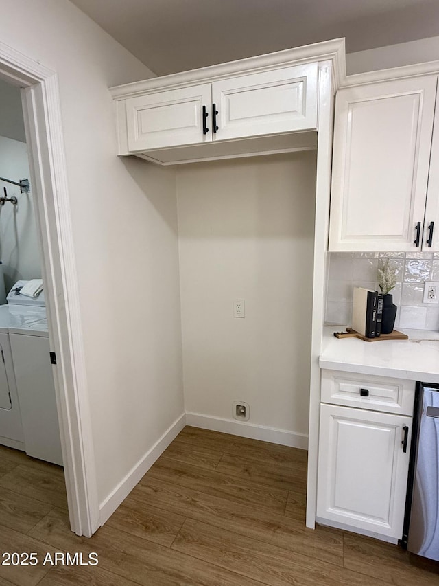 1421 W Pasadena Ave, Phoenix, AZ 85013 - washroom with washer and clothes dryer and wood finished floors