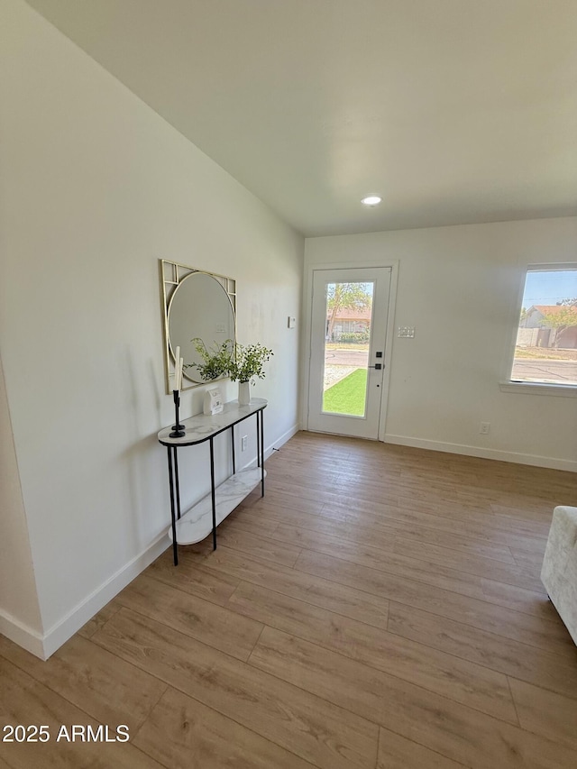 1421 W Pasadena Ave, Phoenix, AZ 85013 - foyer entrance featuring healthy amount of natural light and light wood finished floors