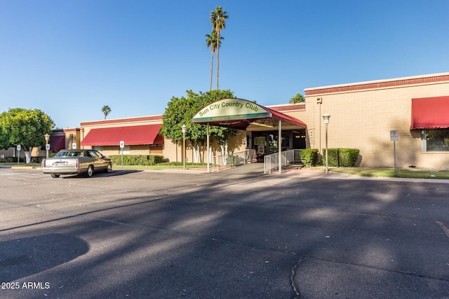 view of property featuring uncovered parking