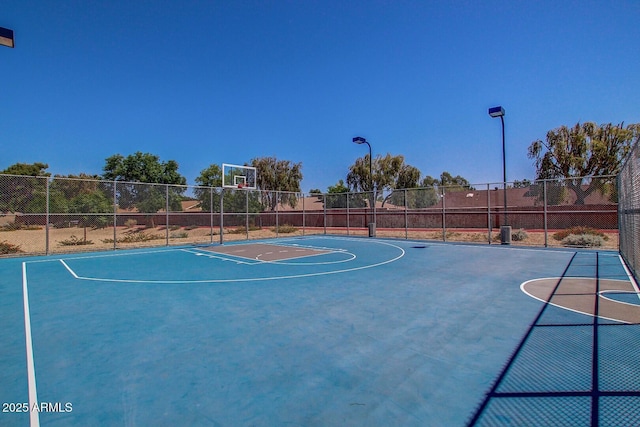 view of sport court with community basketball court and fence