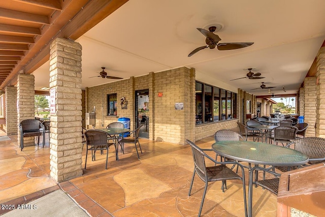 view of patio / terrace with ceiling fan and outdoor dining space