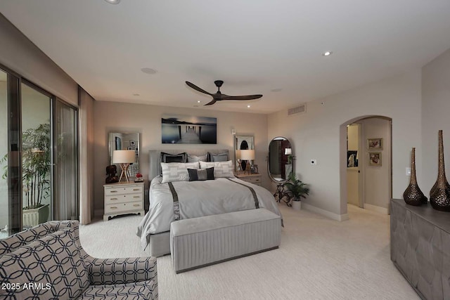 bedroom featuring visible vents, recessed lighting, arched walkways, access to exterior, and light colored carpet