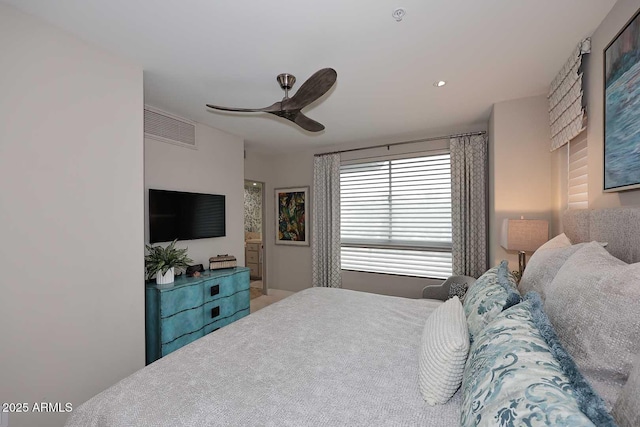 bedroom with visible vents and a ceiling fan