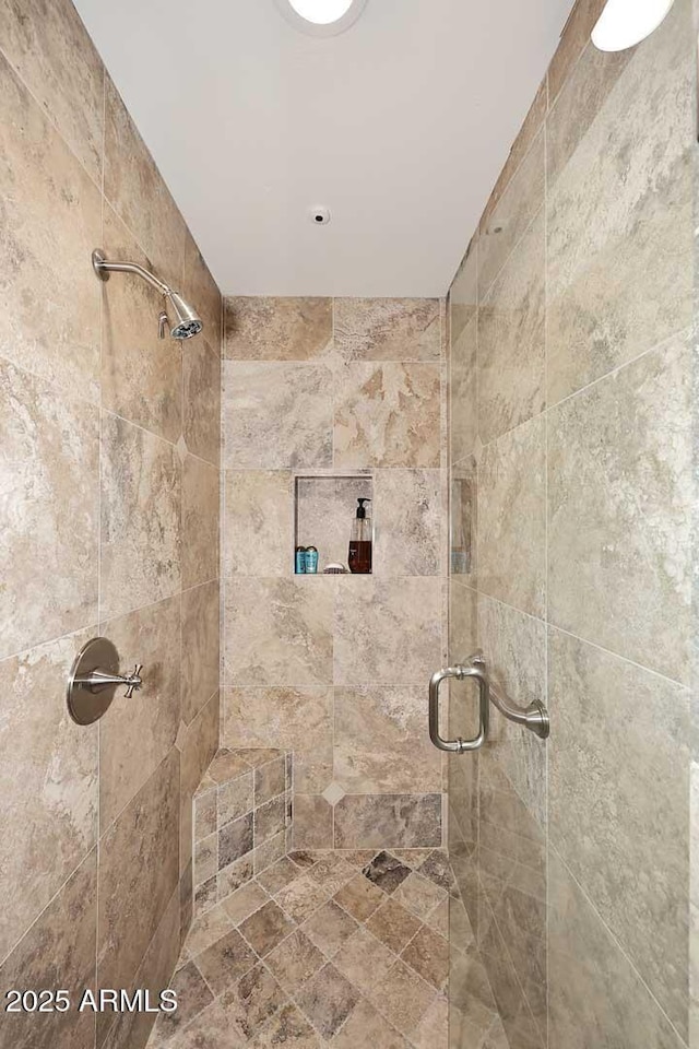 bathroom with a shower stall