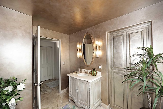 bathroom featuring vanity and baseboards