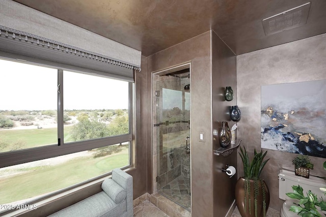 full bathroom featuring visible vents, a stall shower, and toilet