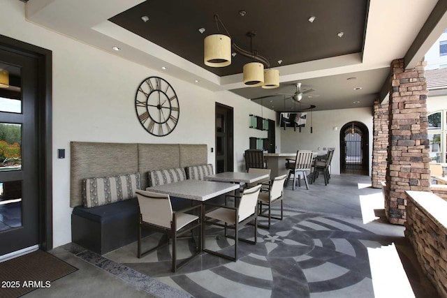 view of patio / terrace featuring outdoor dining area and a ceiling fan