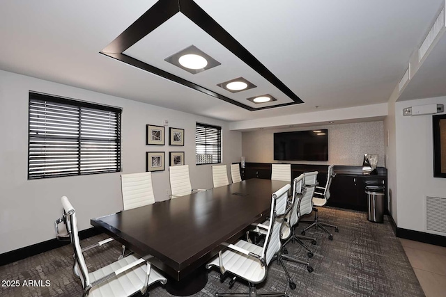 dining room with visible vents and baseboards