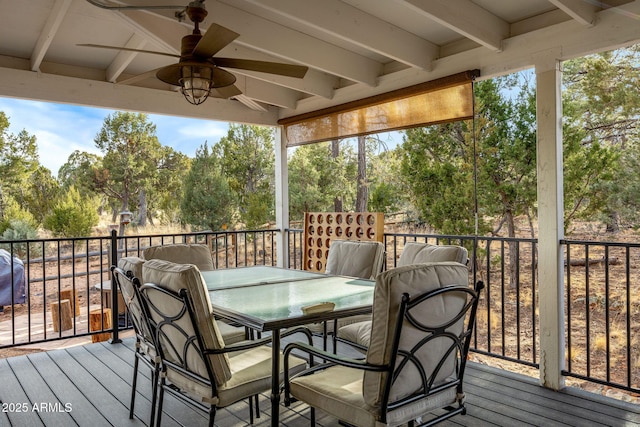 deck featuring ceiling fan and outdoor dining space