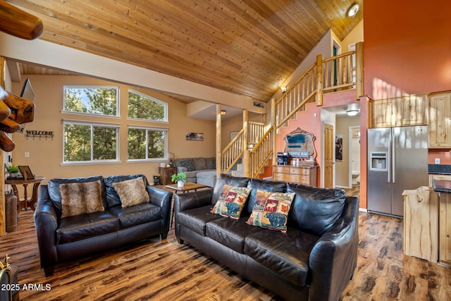 living room with high vaulted ceiling, wood ceiling, stairway, and wood finished floors