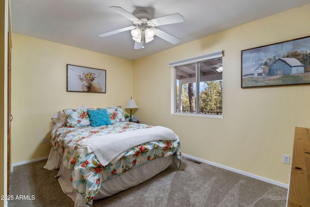 carpeted bedroom featuring visible vents, ceiling fan, and baseboards